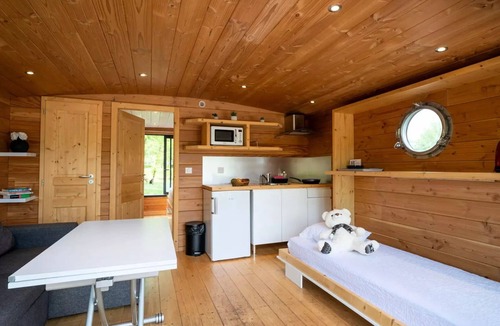 Molinet Cabin | A small boat moored at the dock, 5 people