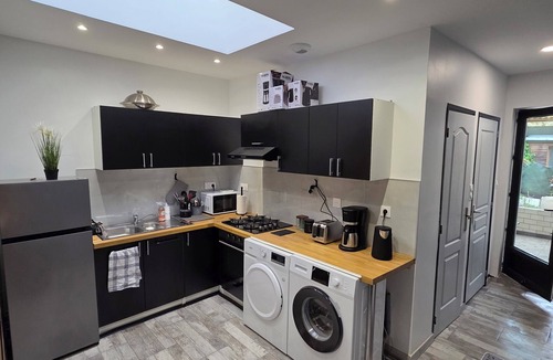 Roubaix House | MAISON LA SOURCE; with 4 bedrooms, a kitchenette (rented separately), and a garden.