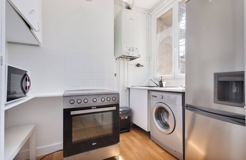 Clichy Apartment | Parisian charm, separate beds, screen and work desk, ideal for families and professionals.