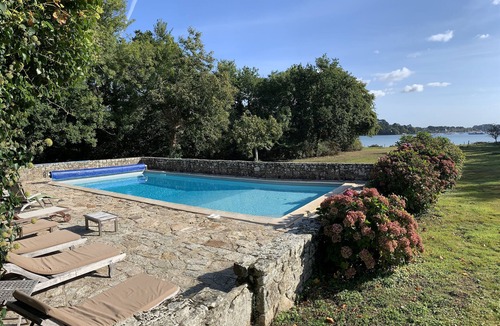 Baden House | Waterfront manor house with heated pool