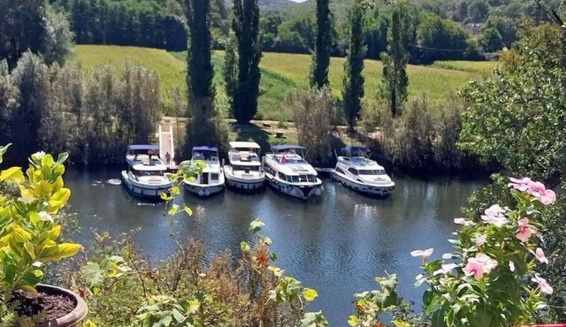 Beautiful character house overlooking Le Lot. Riverside location with slip.