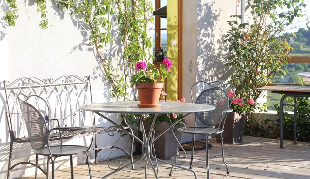 Stylish living in the village square with a large terrace overlooking the Morvan